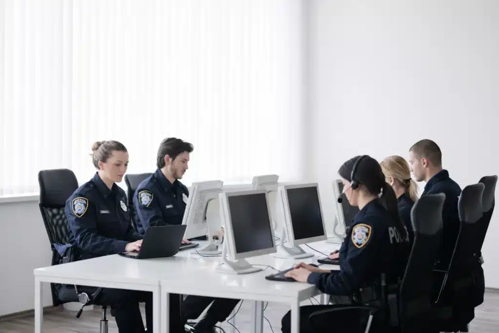 Agency staff managing public safety data in an offic